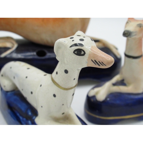 1258 - Pair of Victorian Staffordshire recumbant Greyhound pen holders, another Dalmation, H10cm  and a lar... 