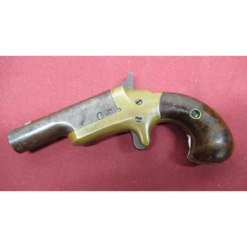1026 - Colt Derringer pistol with brass frame and two piece wooden grip