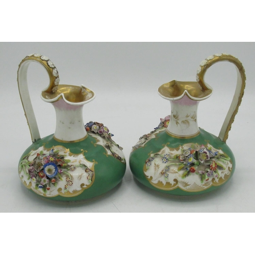 1248 - Pair of Bloor Derby ewers, encrusted with flowers in reserve panels on an apple green ground, with s... 