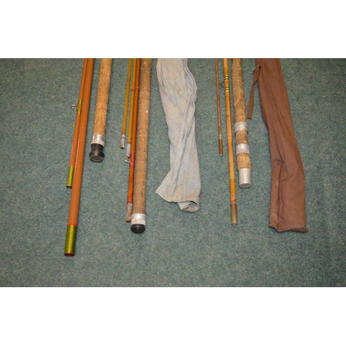 120 - 3 large general purpose vintage fishing rods. 
An Abu 3 piece glass fibre rod with cork handle, over... 