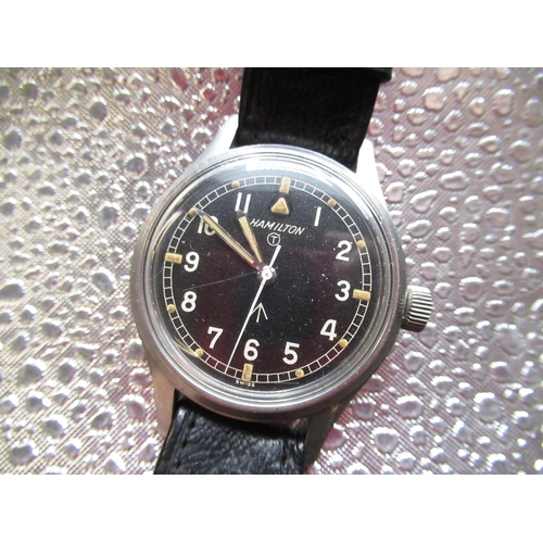 325 - Hamilton General Service RAF Issue hand wound wristwatch. Signed black dial with central hacking sec... 