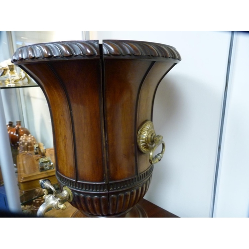 330 - Pair of George III mahogany wine cisterns, on cupboard stands, the cisterns formed as urns with dome... 