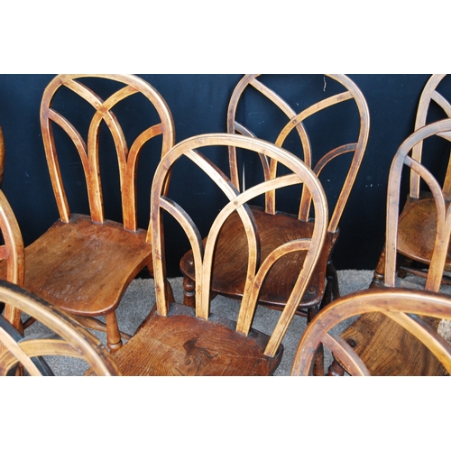 362 - Harlequin set of thirteen country chairs with arched Gothic backs.