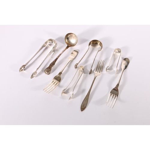 35 - A collection of miscellaneous silver flatware including a pair of Scottish Victorian silver sugar to... 