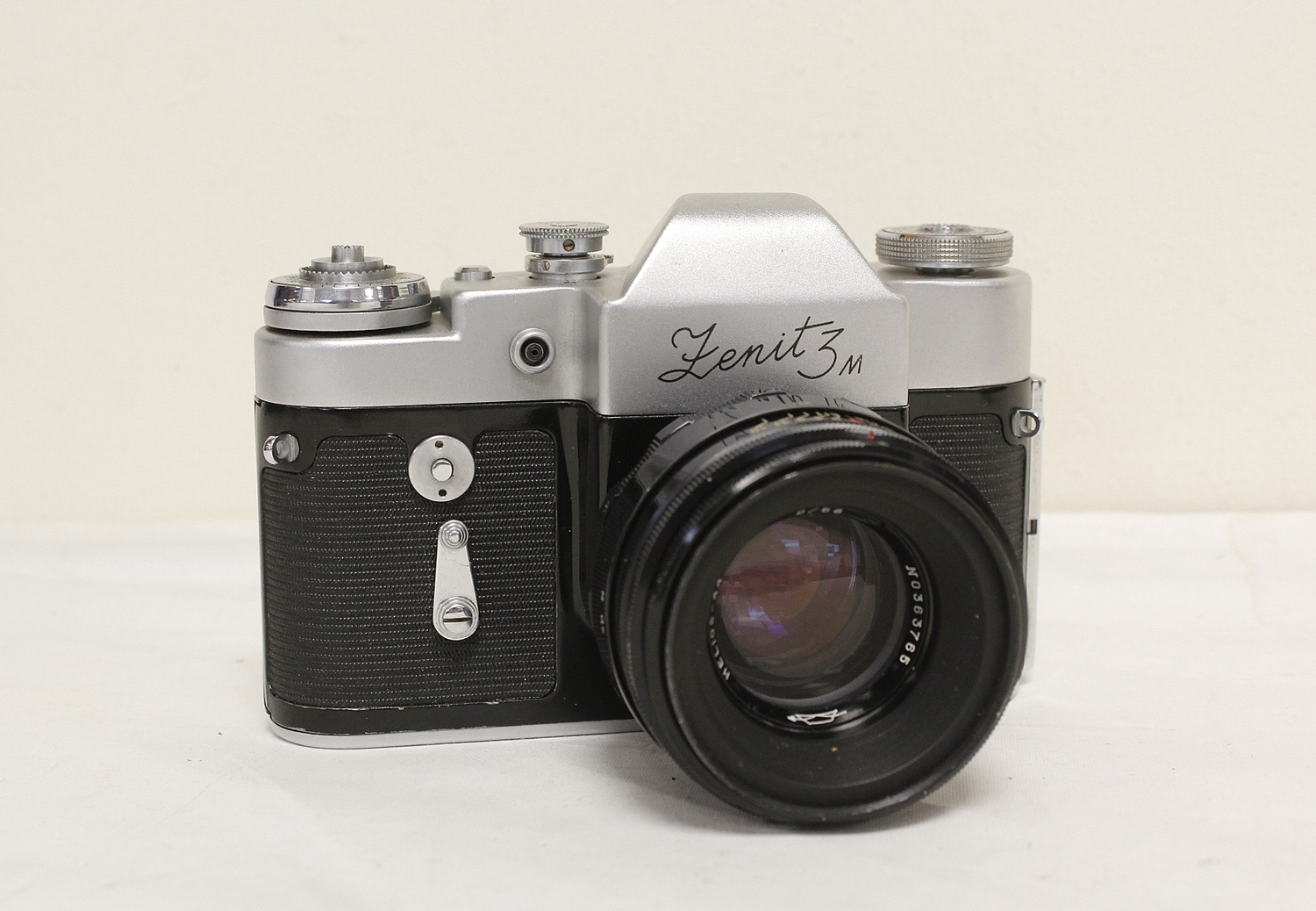Four vintage Zenit cameras to include EM Olympic edition with Helios