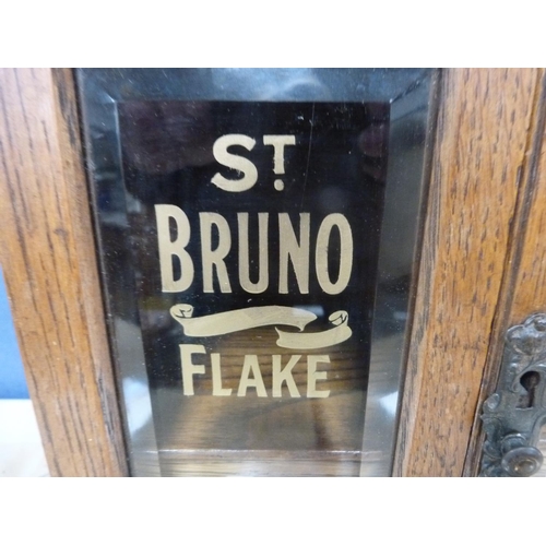 10 - Edwardian oak smoker's cabinet, marked to the glass 'St Bruno Flake'.
