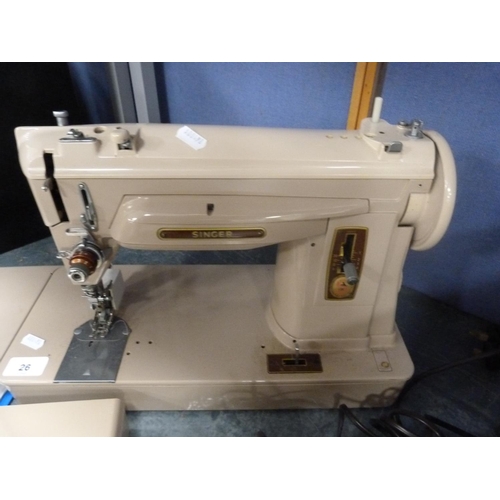 26 - Singer sewing machine.