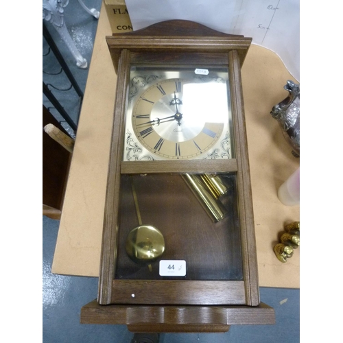 44 - Modern quartz wall clock, EP tea kettle, pair of brass candlesticks, brass monkey group and other br... 