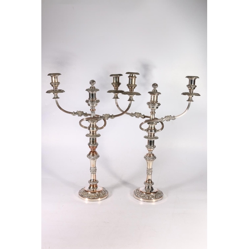 268 - Pair of silver-plate on copper candelabra, with twin branch and sconce, 55cm tall.