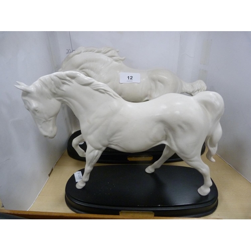 12 - Two Royal Doulton figures of horses, 'Spirit of Freedom' and 'Spirit of Earth', on fixed ebonised pl... 