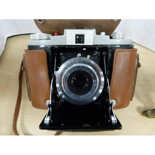22 - Victorian-style gilt metal easel clock and a cased Kodak 66 Model II camera.