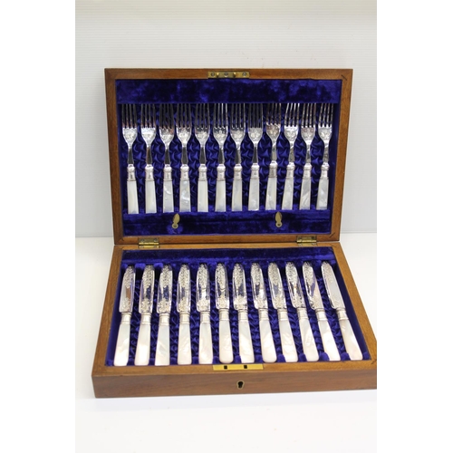 51 - Cased twelve place set of EPNS and mother-of-pearl handled fruit knives and forks.