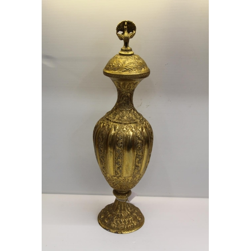 56 - Gilded decorative urn with bird finial, 44cm.