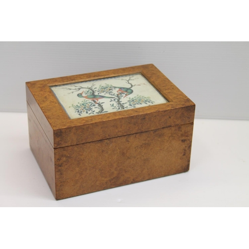8 - Burr wood trinket box, the hinge top inset with watercolour of birds of paradise, probably on pith p... 