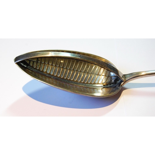 3 - Silver strainer spoon, plain with pierced divider, initialled 'R', by W Eley, 1804, 118g or 3½oz.