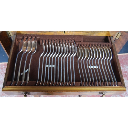 13 - Part canteen of EP cutlery enclosed in an oak table canteen comprising twelve table forks, twelve de... 