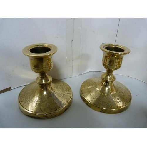 24 - Collection of brassware to include three assorted pairs of candlesticks, trivet, toasting fork, asht... 