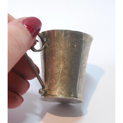 21 - Middle eastern silver engraved cup of tapering shape, probably Persian, 41mm high, 28g.