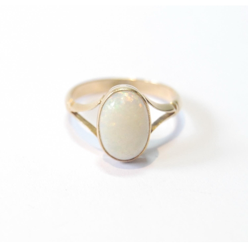28 - Opal ring, the cabochon 11mm x 7mm, in gold, '18ct', size M.