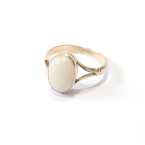 28 - Opal ring, the cabochon 11mm x 7mm, in gold, '18ct', size M.