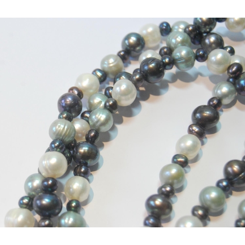 40 - Long pearl necklace, blue, black and other hues.