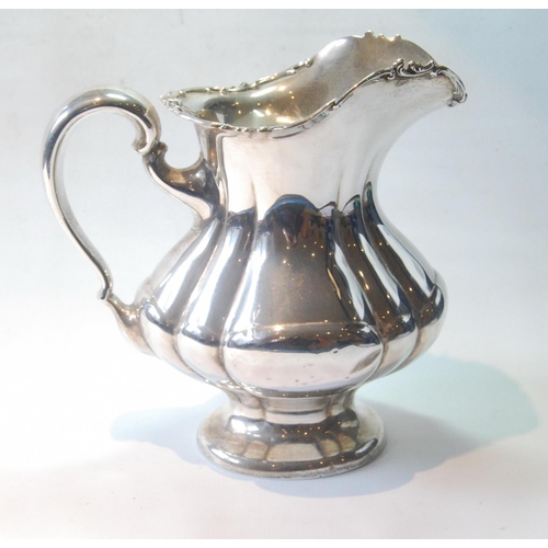 46 - American silver water jug of lobed pear shape, inscribed and dated 1901, 24cm, 714g or 22oz.