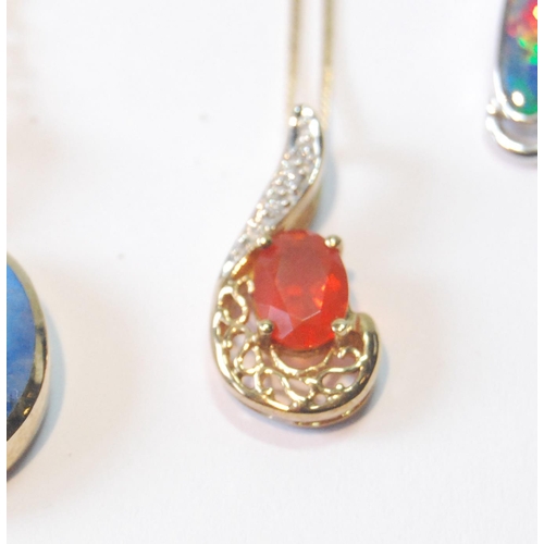 53 - Fire opal and diamond pendant, another, doublet opal, a pendant with caged faceted citrine drop and ... 