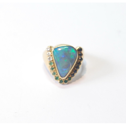 54 - Gold dress ring of triangular form with doublet black opal and other gems, in 18ct gold, size R.