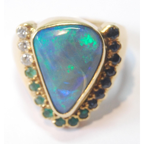 54 - Gold dress ring of triangular form with doublet black opal and other gems, in 18ct gold, size R.