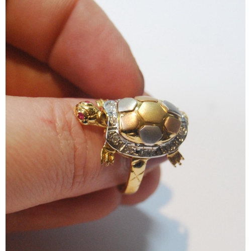 56 - Coloured gold dress ring modelled as a turtle with ruby eyes and diamond-bordered shell and moveable... 