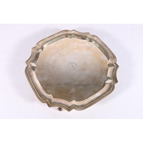 29 - Indian sterling silver salver with pie crust edge on four scroll feet, Hamilton and Co, Calcutta, 19... 