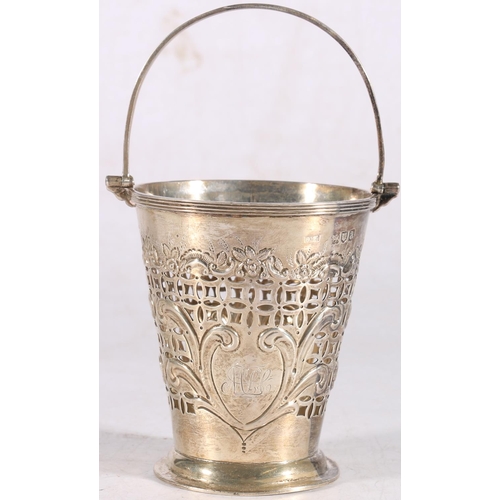 8 - Victorian sterling silver swing-handled bucket, the pierced body with heavy foliate decoration, Josi... 