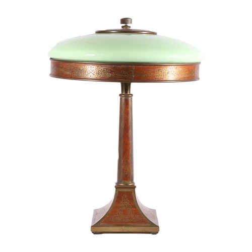 French style early 20th century Art Deco style mahogany table lamp with decorative brass inlay having green opaline glass shade, in the shape of an American Guardsman lamp, 49cm tall.