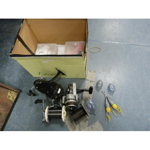 19 - Carton containing boat reels to include Mitchell 600, Shakespeare Alpha 050, rods, accessories etc.