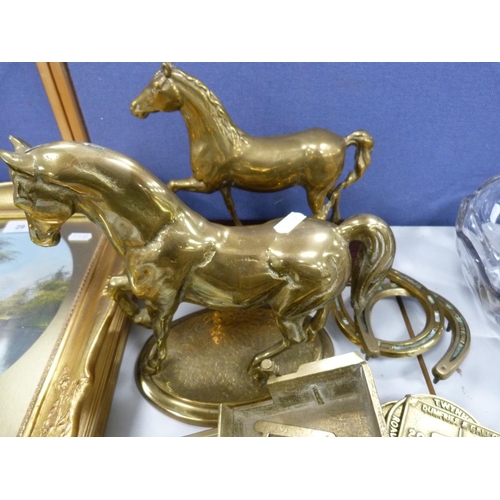28 - Collection of brass to include two brass horse figures, horseshoes, horse and carriage group, horse ... 