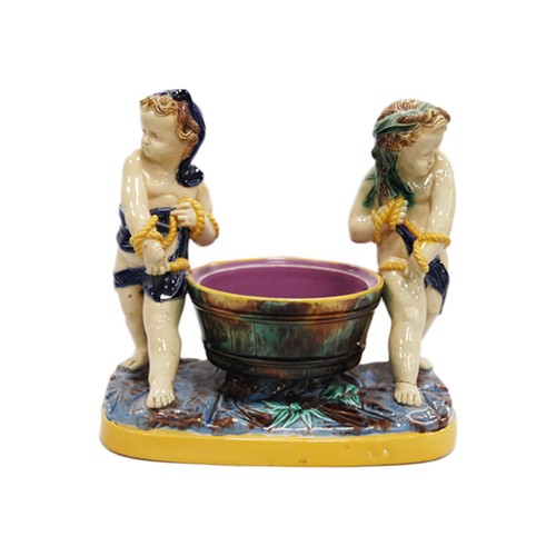 19th century majolica figure group, continental porcelain vase with cover, 19th century Moore's-style figural centrepiece modelled as putti carrying a carriage (all a/f).