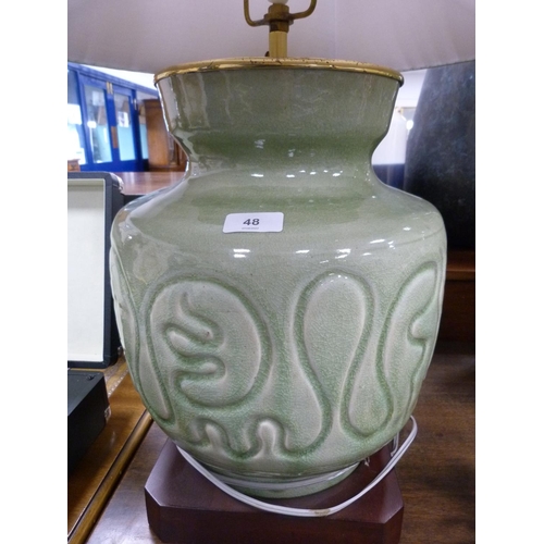 48 - Chinese-style celadon glazed table lamp with shade, on plinth base.