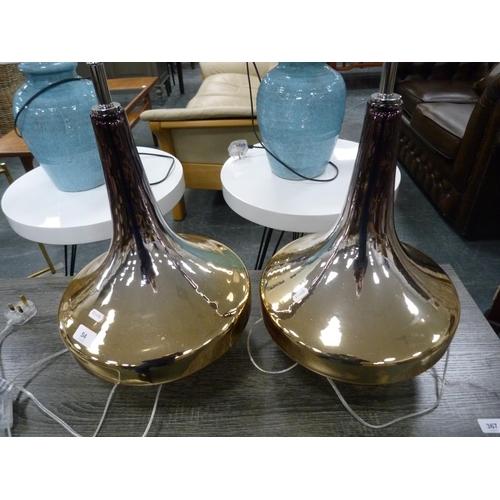 54 - Pair of contemporary baluster-shaped gold coloured table lamps.  (2)