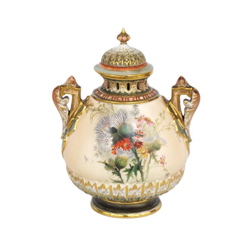Royal Worcester blush ivory vase and cover, c. 1905, decorated with panels of thistles and flowers, glazed in green and gilt, shape no. 1995, no. 316660, green mark to the underside, approximately 20cm high.