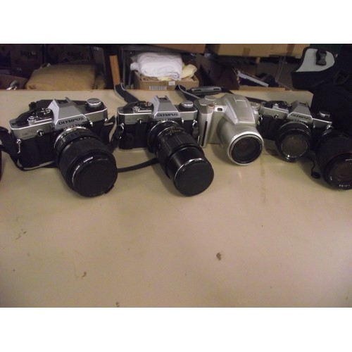 20 - 4 Retro Olympus cameras and extra lenses ect