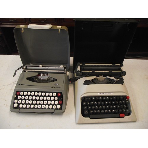 7 - 2 Retro Typewriters cased.