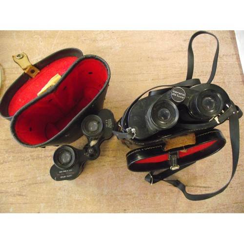 31 - 2 pair of vintage binoculars.