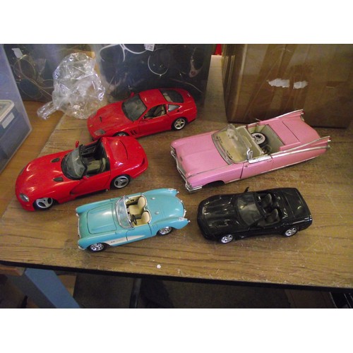 52 - Various large scale diecast cars.