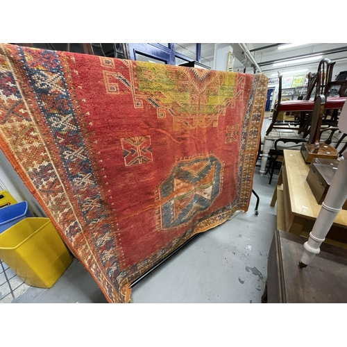 52 - Rugs: Early 20th cent. Wool Berber rug red ground with medallions, bought from traders in Morocco in... 