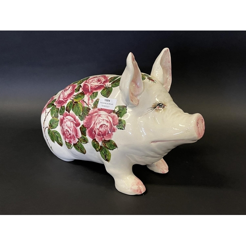 1004 - A Large Wemyss Pig, 20th century decorated with large overblown pink cabbage roses signed 'wemyss ex... 
