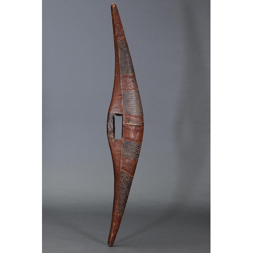 SUPERB EARLY INCISED PARRYING SHIELD, DARLING RIVER REGION, NEW SOUTH WALES, Carved and engraved hardwood and natural pigment (no custom stand) Early nineteenth century. Parrying Shield of bi-convex section and elongated triangular profile, with solid cut handle, showing beautifully carved sections of chevron and linear motifs emphasised by the surrounding smooth surface, terminating with undecorated bosses on the upper and lower face. Approx L80 x 13cm. PROVENANCE
Dr Gerald Holt Collection H319
Lord McAlpine Collection
Private collection, France
Private collection, Sydney