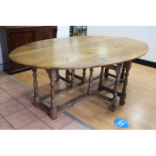 1054 - Most impressive oak wake table, oval top with fall leaves, turned supports, rectangular stretchers, ... 