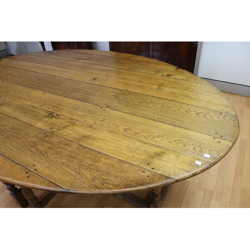 1054 - Most impressive oak wake table, oval top with fall leaves, turned supports, rectangular stretchers, ... 