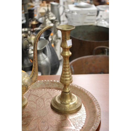 36 - Middle Eastern tray along with a coffee pot and candlestick, approx 35cm Dia and smaller (3)