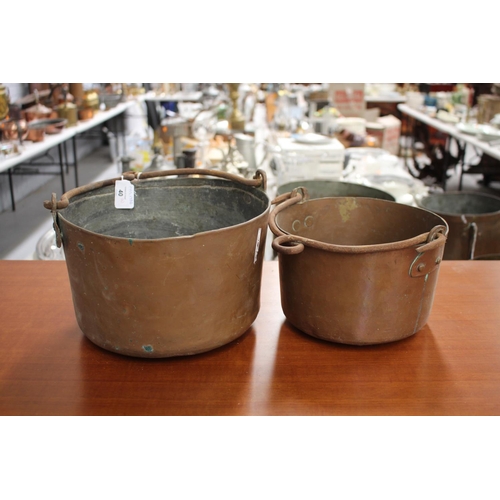 40 - Two antique French copper swing handled pots, with iron handles, approx 17cm H x 29cm Dia and smalle... 